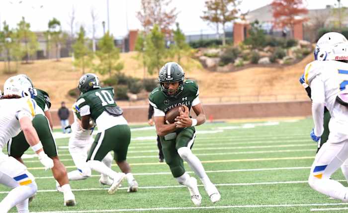 Muskogee quarterback Jamarian Ficklin (with ball) by Michael Kinney